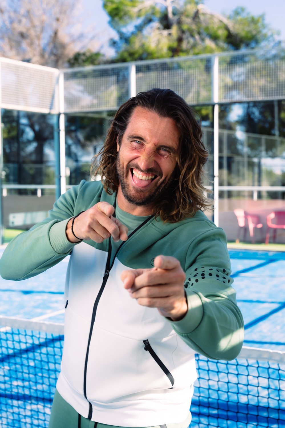 An Ibiza Padel Academy coach with a racket on the court